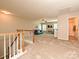 Spacious bonus room with neutral carpet, ceiling fan, and natural light at 1033 Lilly Pond Dr, Fort Mill, SC 29715