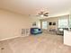 Open bonus room with a ceiling fan and lots of natural light from bright windows at 1033 Lilly Pond Dr, Fort Mill, SC 29715