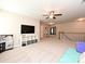Upstairs living space with neutral carpet, a ceiling fan, and a view of the staircase at 1033 Lilly Pond Dr, Fort Mill, SC 29715