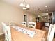 Dining room showcases table seating for six, and an open layout to the kitchen and living room at 1033 Lilly Pond Dr, Fort Mill, SC 29715