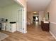 Welcoming foyer with wood floors leading to a staircase and the living areas at 1033 Lilly Pond Dr, Fort Mill, SC 29715