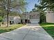 Charming two-story home featuring a well-kept lawn and a long driveway at 1033 Lilly Pond Dr, Fort Mill, SC 29715