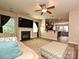 Inviting living room with wood floors, a fireplace, and a bar-style kitchen counter at 1033 Lilly Pond Dr, Fort Mill, SC 29715
