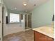 Relaxing primary bath with soaking tub, glass shower, and neutral tile at 1033 Lilly Pond Dr, Fort Mill, SC 29715