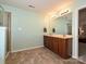 Large primary bathroom with double sinks, tiled floors, and updated fixtures at 1033 Lilly Pond Dr, Fort Mill, SC 29715