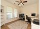 Bright home office featuring large windows, ample workspace, and neutral decor at 1033 Lilly Pond Dr, Fort Mill, SC 29715