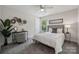 Comfortable bedroom with soft carpet, stylish wall decor, and large window that offers natural light at 1112 Allman Ext, Mount Pleasant, NC 28124