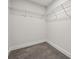 Walk-in closet equipped with wire shelving and plush carpeting for optimal organization and comfort at 1112 Allman Ext, Mount Pleasant, NC 28124