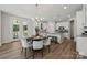 Dining area with a modern chandelier and ample natural light from the nearby deck at 1112 Allman Ext, Mount Pleasant, NC 28124