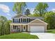 Beautiful two-story home with a front porch and well-maintained lawn at 1112 Allman Ext, Mount Pleasant, NC 28124