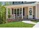 Charming front porch with decorative wreath and manicured lawn at 1112 Allman Ext, Mount Pleasant, NC 28124