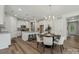 Kitchen and dining area with modern white cabinetry and stainless steel appliances at 1112 Allman Ext, Mount Pleasant, NC 28124