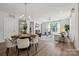 Open-concept living area with a fireplace, modern lighting, and sleek, neutral decor at 1112 Allman Ext, Mount Pleasant, NC 28124