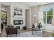 Bright living room with modern fireplace, stylish decor, and large window at 1112 Allman Ext, Mount Pleasant, NC 28124