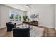 Bright office with large window, stylish desk, and comfortable chairs at 1112 Allman Ext, Mount Pleasant, NC 28124