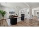 Open office features wood floors, modern fireplace, and comfortable seating at 1112 Allman Ext, Mount Pleasant, NC 28124