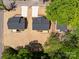 An aerial view showcasing a landscaped yard, new home construction, and a private deck at 112 Cleveland Ave, Albemarle, NC 28001
