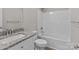 Bathroom with granite vanity, modern faucet, and shower-tub combination at 112 Cleveland Ave, Albemarle, NC 28001