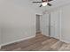 Bright bedroom features modern ceiling fan, neutral paint, and new flooring at 112 Cleveland Ave, Albemarle, NC 28001