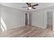 Unfurnished bedroom features modern paint, new flooring, and two closets at 112 Cleveland Ave, Albemarle, NC 28001