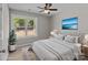 Bedroom featuring a large bed, modern decor, and a sunlit window at 112 Cleveland Ave, Albemarle, NC 28001