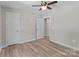 Unfurnished bedroom features new flooring, neutral paint, and two closets at 112 Cleveland Ave, Albemarle, NC 28001