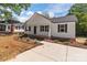 Well-maintained home featuring a new roof, dark shutters, and refreshed landscaping at 112 Cleveland Ave, Albemarle, NC 28001