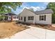 Charming one-story home with white siding, black shutters, and a cozy front porch at 112 Cleveland Ave, Albemarle, NC 28001