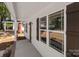 Close-up of the home's porch light, windows, and white siding at 112 Cleveland Ave, Albemarle, NC 28001
