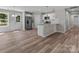 Open kitchen with white cabinets, stainless steel appliances, and an eat-in bar at 112 Cleveland Ave, Albemarle, NC 28001