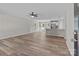 Open-concept living space with luxury vinyl plank flooring and a modern kitchen at 112 Cleveland Ave, Albemarle, NC 28001