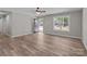 Open-concept living space with luxury vinyl plank flooring and bright natural light at 112 Cleveland Ave, Albemarle, NC 28001