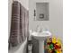 Bright bathroom with white pedestal sink and decorative towel at 1161 Constitution Park Blvd, Rock Hill, SC 29732
