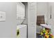 A bathroom and laundry area are combined in this small, utilitarian space at 1161 Constitution Park Blvd, Rock Hill, SC 29732