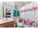 Bathroom with colorful shower curtain and a view to the main bedroom at 1161 Constitution Park Blvd, Rock Hill, SC 29732
