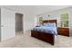 A sunny bedroom with a bed, matching bedside tables, and bright windows at 1161 Constitution Park Blvd, Rock Hill, SC 29732