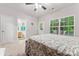 Bedroom includes a window view and a bathroom with warm wood cabinets at 1161 Constitution Park Blvd, Rock Hill, SC 29732