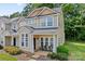Charming two-story townhome featuring a welcoming front porch and well-manicured lawn at 1161 Constitution Park Blvd, Rock Hill, SC 29732