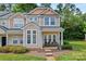 Attractive townhome with a cozy porch, showcasing curb appeal and a well-maintained lawn at 1161 Constitution Park Blvd, Rock Hill, SC 29732