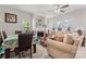 Inviting living area with a fireplace, complemented by a dining set and natural light at 1161 Constitution Park Blvd, Rock Hill, SC 29732
