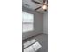 This bedroom has neutral carpet, a ceiling fan and good natural light at 1210 Longwall Ln, Matthews, NC 28104