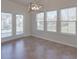 The breakfast nook features a modern light fixture and abundant natural light at 1210 Longwall Ln, Matthews, NC 28104