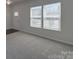 Bright room with new carpet and neutral walls, ready to be personalized and transformed into a living space at 1210 Longwall Ln, Matthews, NC 28104