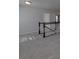 Upstairs hallway showing carpeted floor and wood and white railing at 1210 Longwall Ln, Matthews, NC 28104