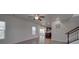 Open-concept living space with sleek flooring, recessed lighting, and a view into the modern kitchen at 1210 Longwall Ln, Matthews, NC 28104