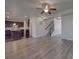 Open-concept living space with sleek flooring, recessed lighting, and a view into the modern kitchen at 1210 Longwall Ln, Matthews, NC 28104