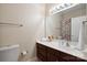 Bathroom with dark cabinets, a large mirror, a shower curtain and neutral paint at 123 Shoreview Dr, Mooresville, NC 28117