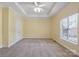 The bedroom features neutral carpeting and a window for plenty of natural light at 123 Shoreview Dr, Mooresville, NC 28117