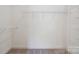 Walk-in closet with white shelving and neutral carpet for optimal storage at 123 Shoreview Dr, Mooresville, NC 28117