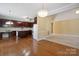 Kitchen featuring wood cabinets, center island, breakfast nook and hardwood floors at 123 Shoreview Dr, Mooresville, NC 28117